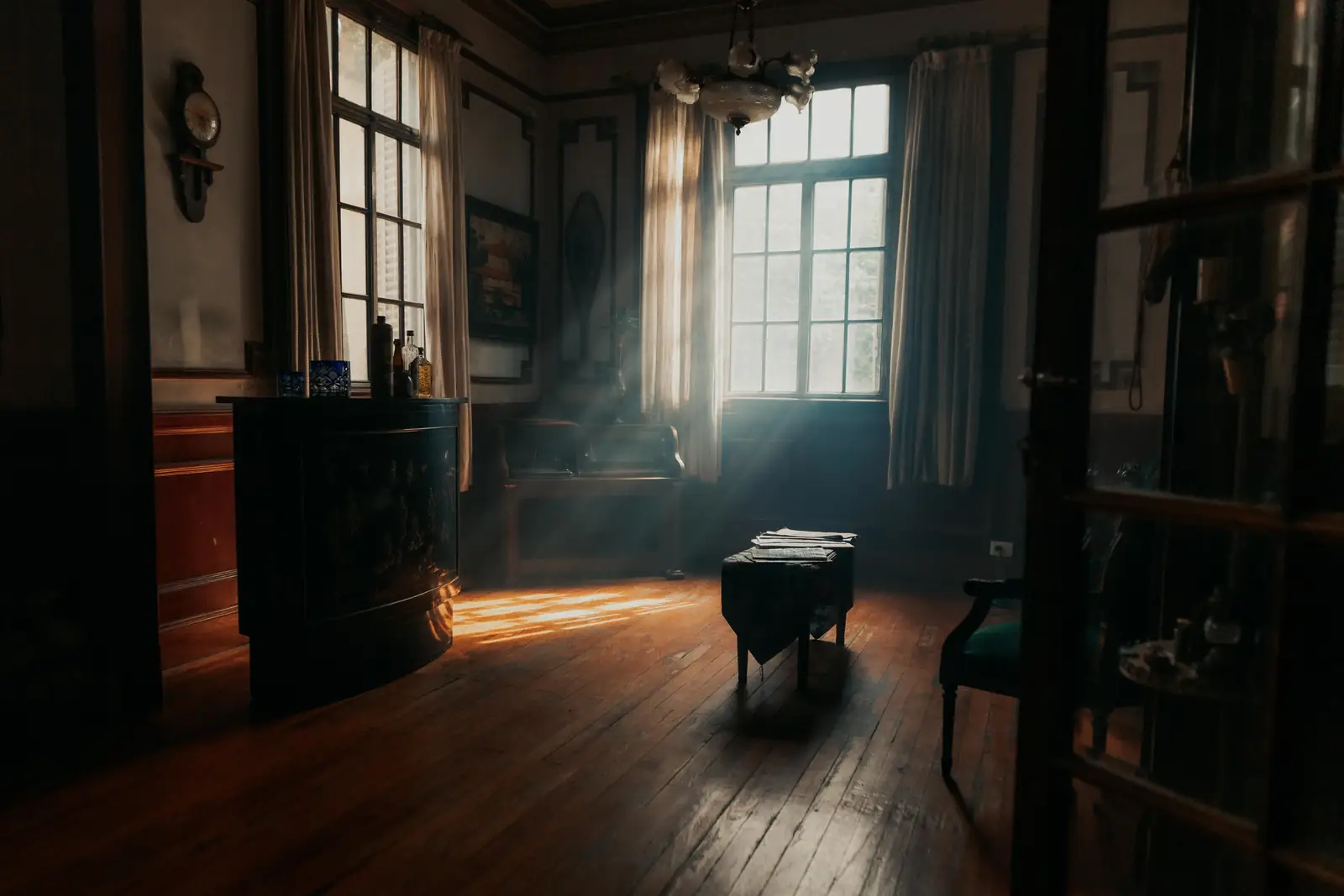 A sunlit vintage Buenos Aires interior with wooden floors and lace curtains, representative of the café's belle-époque rooms